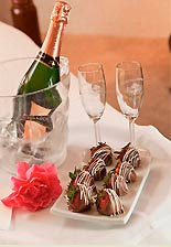 Champagne with glasses and a tray of chocolates