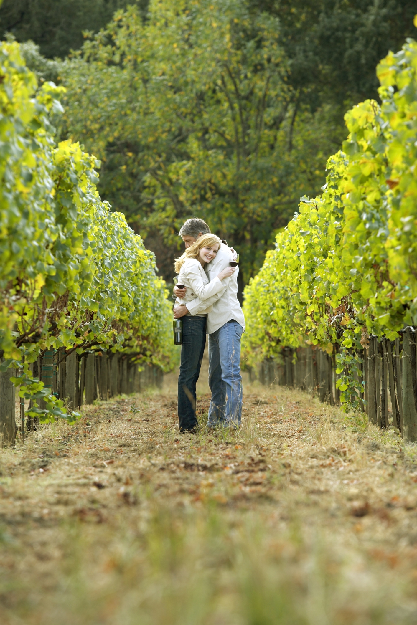 Couple hugging in vineyard, Napa Valley, California, USA