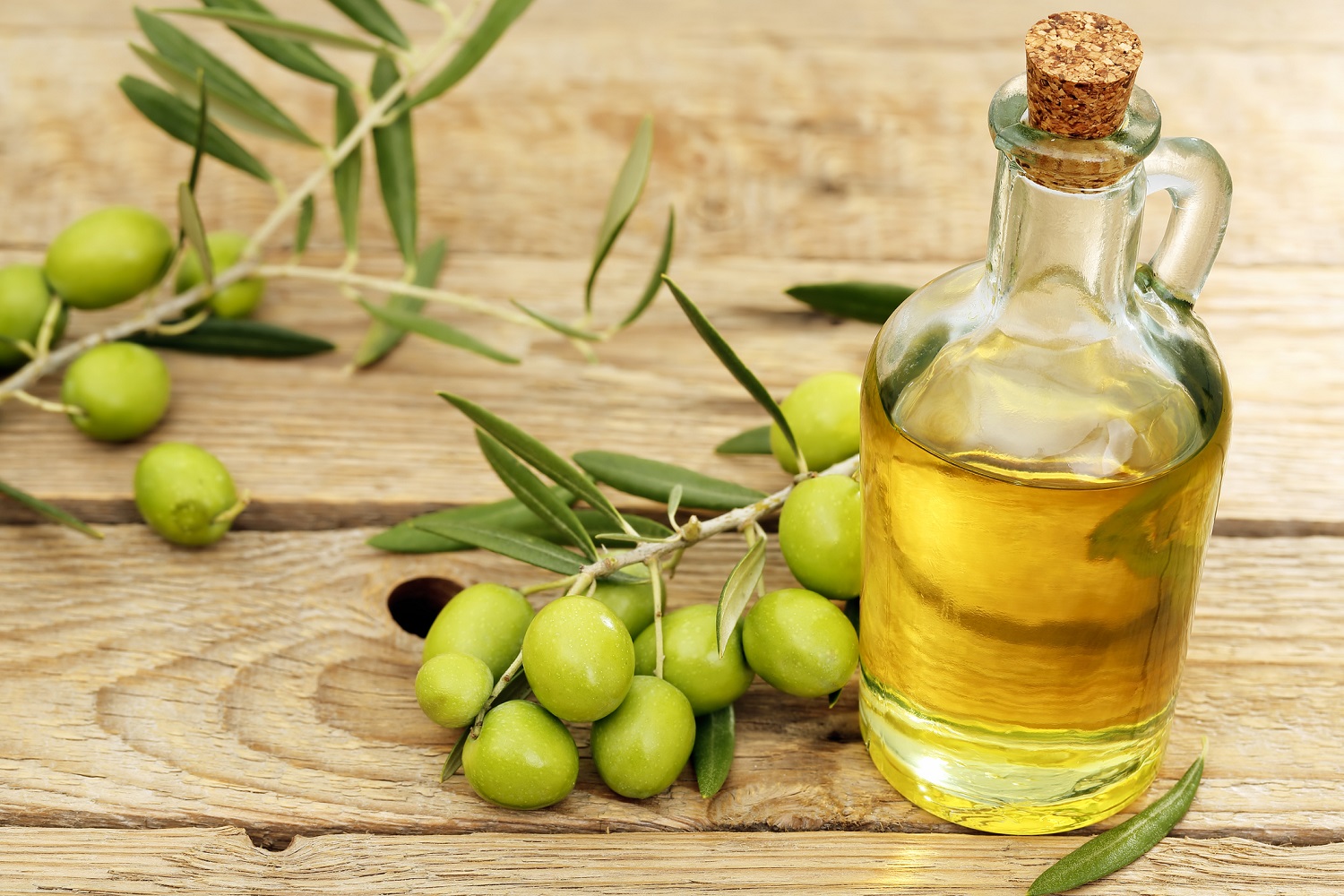 Olives and a bottle of Olive Oil