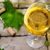 enjoy a glass of chardonnay at Poseidon Vineyard