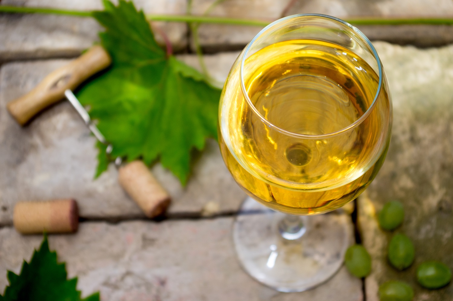 A glass of Chardonnay in an outdoor setting