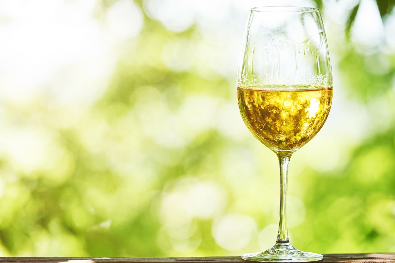 Glass of Chardonnay against a natural background